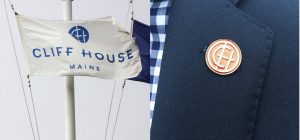 nautical sailboat flag design, luxury resort guest experience, employee navy uniform design with custom pin